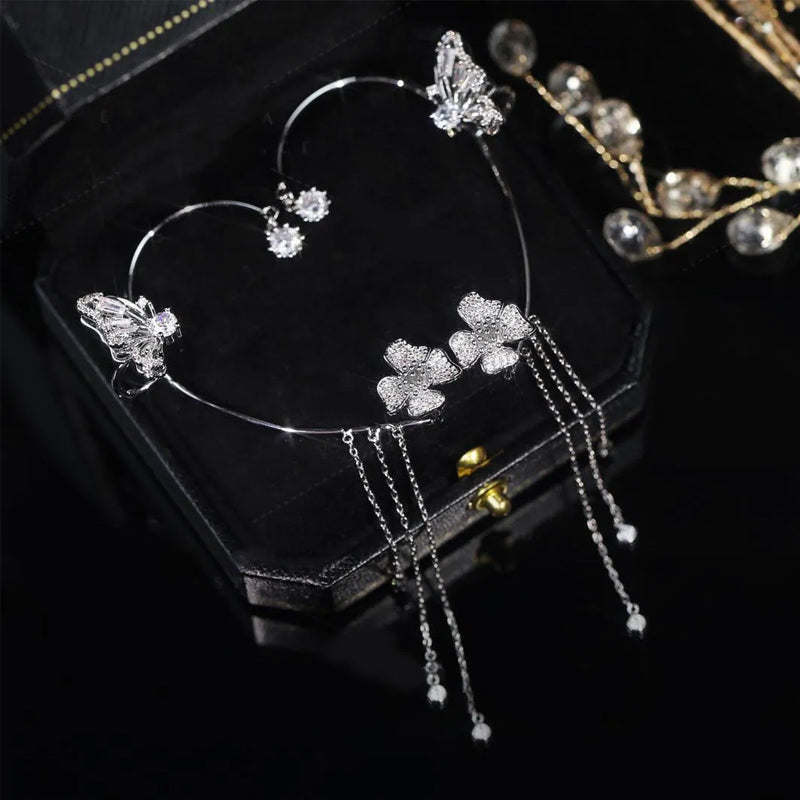 Boucles d'oreilles avec zircone et pompons en forme de papillons