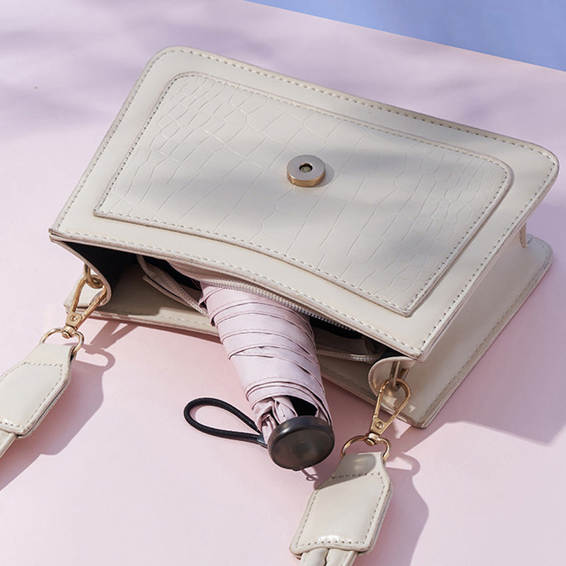 An ultra-light (103g), portable, all-season protective umbrella—UV-resistant, durable, and suitable for both sun and rain—your pocket-sized personal "bodyguard."